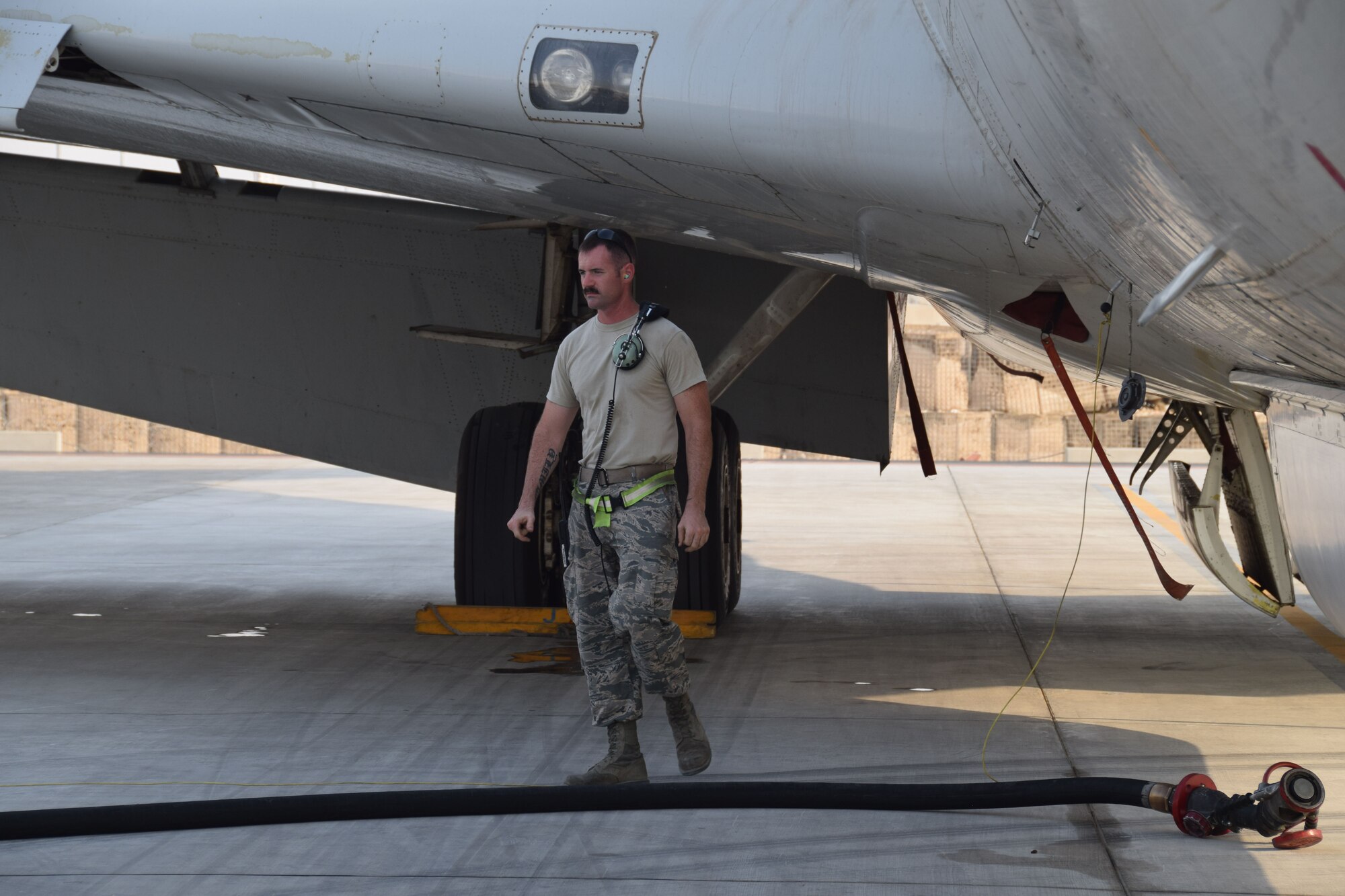 Staff Sgt. Dustin Miller, a crew chief deployed here from Robins AirForce Base, Ga., rom the 7th Expeditionary Air Mobility Unit prepares a fuel line to load a E-8C Joint Surveillance Target Attack Radar System prior to a mission on Sept. 12, 2016, at Al Udeid Air Base, Qatar. JSTARS aircrew report the information they collect to theater ground and air commanders to ensure coalition forces have real-time data in support on the war on terror. (U.S. Air Force photo/Tech. Sgt. Carlos J. Trevino/Released)