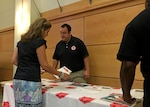 Employees at NSA Philadelphia receive information from a Salvation Army Emergency Disaster Services representative during DLA Troop Support's annual National Preparedness Month event Sept. 8. The event also featured representatives from the Federal Emergency Management Agency, the Pennsylvania Emergency Management Agency and the Red Paw Emergency Relief Team.