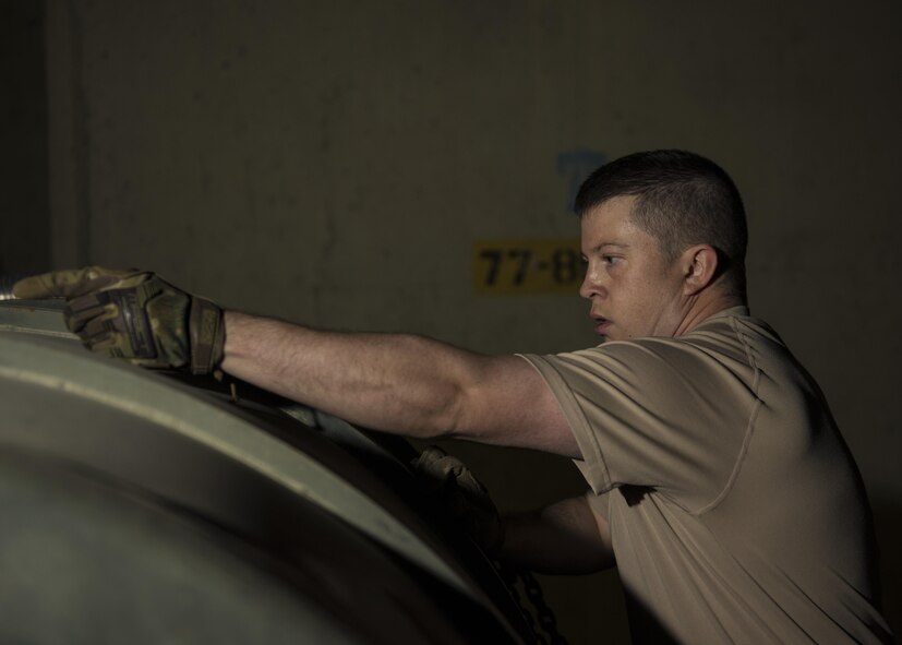 Staff Sgt. Nathan Knight, 455th Expeditionary Logistics Readiness Squadron cryogenics supervisor, unhooks a liquid oxygen tank hose, Bagram Airfield, Afghanistan, Sept. 14, 2016. The 455th ELRS received 400-gallon liquid oxygen tanks from the 379th ELRS at Al Udeid Air Base, Qatar, which ships liquid oxygen and liquid hydrogen daily to other bases throughout the U.S. Air Forces Central Command’s area of responsibility. The oxygen goes through a series of tests before being used in aircraft. (U.S. Air Force photo by Senior Airman Justyn M. Freeman)