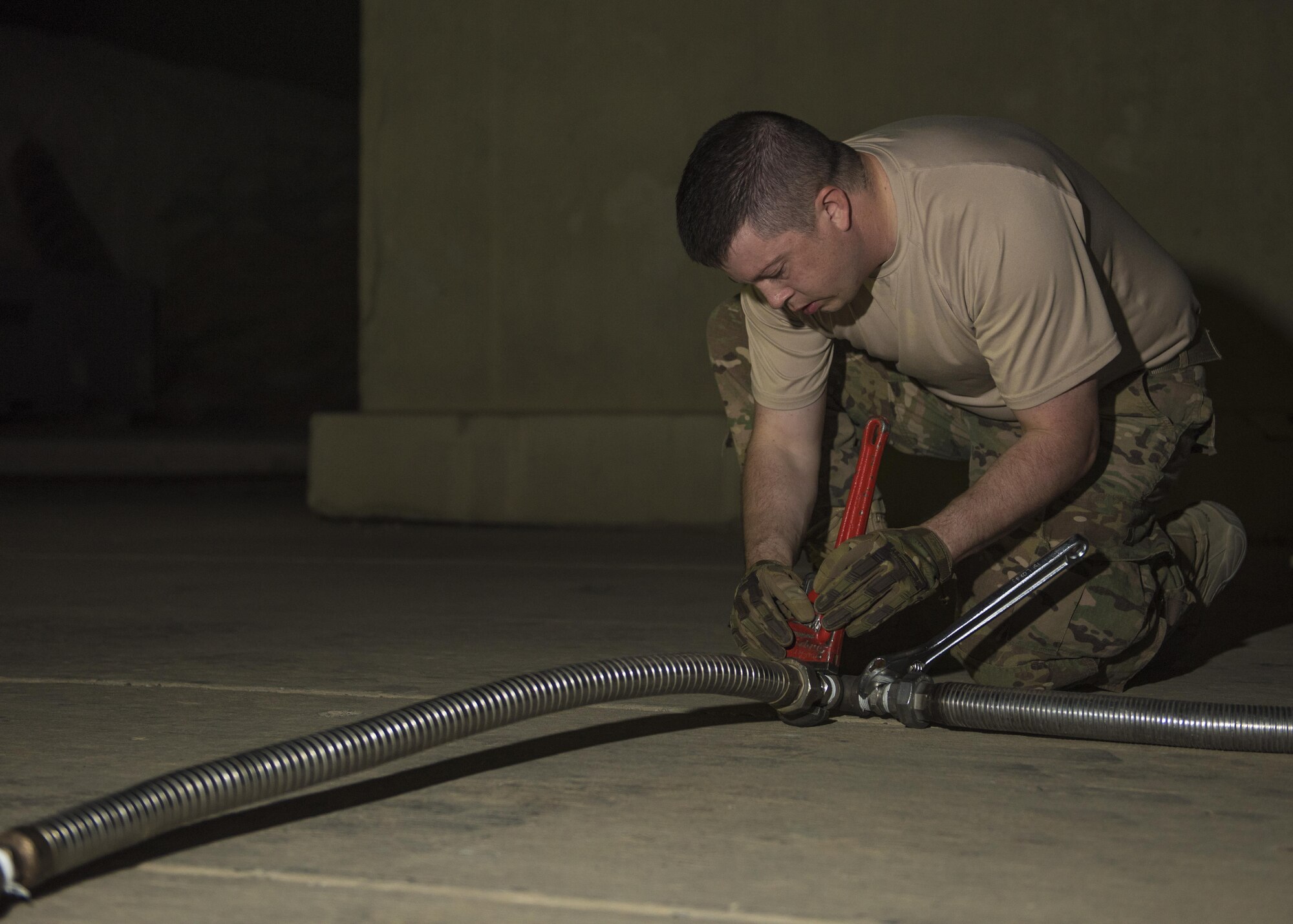 Staff Sgt. Nathan Knight, 455th Expeditionary Logistics Readiness Squadron cryogenics supervisor, adjusts a liquid oxygen tank hose, Bagram Airfield, Afghanistan, Sept. 14, 2016. The liquid oxygen tanks are supplied through the 379th ELRS at Al Udeid Air Base, Qatar. Once the oxygen is restored back into aircraft, the tanks are reconstructed and send back to Al Udeid for refill and reuse. (U.S. Air Force photo by Senior Airman Justyn M. Freeman)