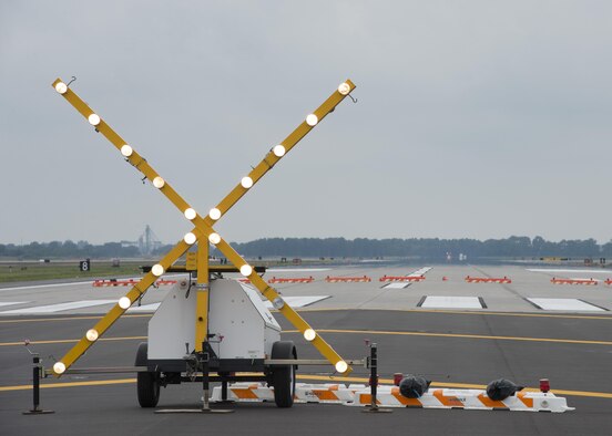 A temporary runway closure sign flashes on the end of Runway 01-19 Sept. 1, 2016, on Dover Air Force Base, Del. This sign will be removed from the runway Sept. 23, opening it for use. (U.S. Air Force photo by Senior Airman Zachary Cacicia)