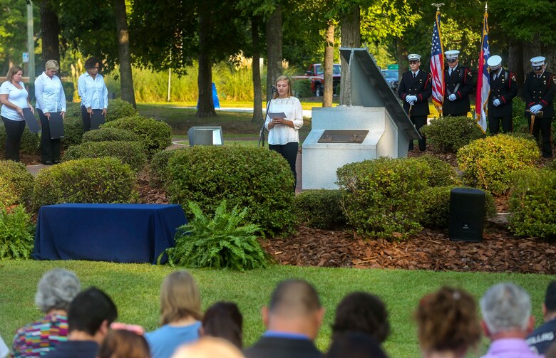 Members of the community bow their heads for a moment of silence in remembrance for the victims of the Sept. 11, 2001 attacks during the Patriot Day Observance Ceremony at the Lejeune Memorial Gardens on Marine Corps Base Camp Lejeune, Sept. 11, 2016. The community stood together to remember the victims of the Sept. 11, 2001 terrorist attacks during the 15 year anniversary.