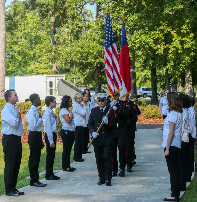 The Jacksonville Fire Honor Guard retires the colors after a moment of reflection and remembrance during the Patriot Day Observance Ceremony at the Lejeune Memorial Gardens on Marine Corp Base Camp Lejeune, Sept. 11, 2016. The community stood together to remember the victims of the Sept. 11, 2001 terrorist attacks during the 15 year anniversary.