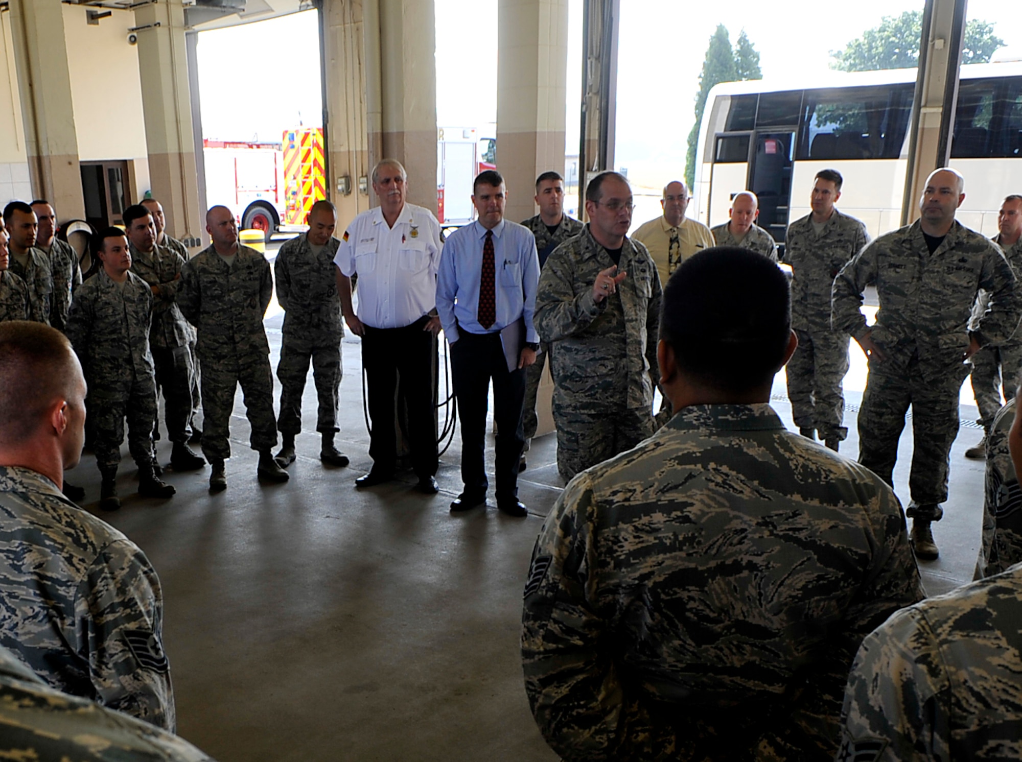 Brig. Gen. Richard Moore, 86th Airlift Wing commander, talks with 86th Civil Engineer Squadron firefighters Sept. 2, 2016, at Ramstein Air Base, Germany. The Airmen are one of several squadrons in the 86th Civil Engineer Group. They support the mission by providing emergency services to Ramstein, Vogelweh Military Complex, Rhine Ordinance Barracks and Landstuhl military installations. (U.S. Air Force photo/Senior Airman Larissa Greatwood) 