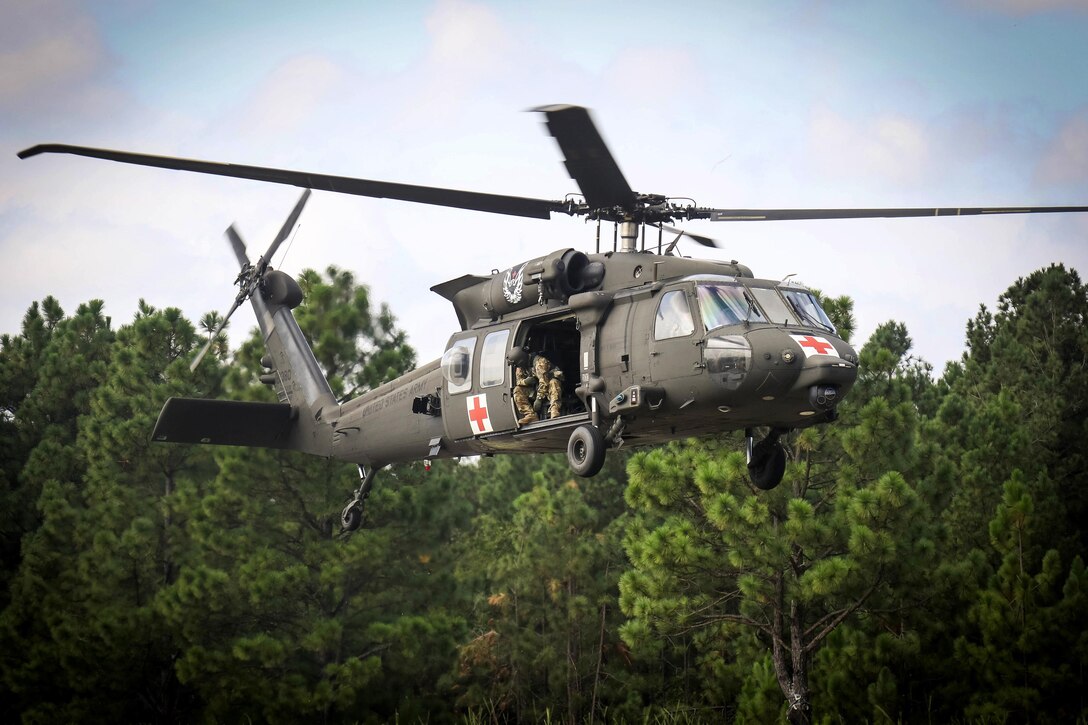 An HH-60 Black Hawk medevac helicopter prepares to land for a simulated casualty during a training exercise at Fort Bragg, N.C., Sept. 12, 2016. The helicopter crew is assigned to the 82nd Airborne Division’s Medical Evacuation Helicopter Company, 3rd General Support Aviation Battalion. Army photo by Capt. Adan Cazarez