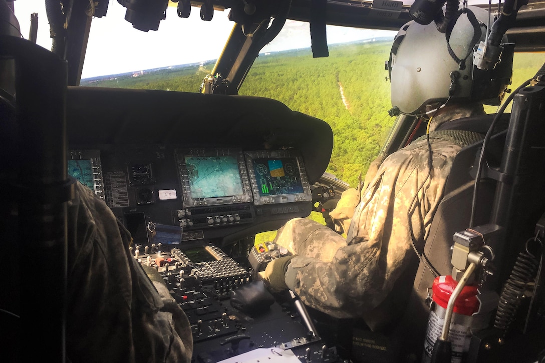 Army pilots fly an HH-60 Black Hawk medevac helicopter to participate in an exercise at Fort Bragg, N.C., Sept. 12, 2016. Army photo by Major John Houk