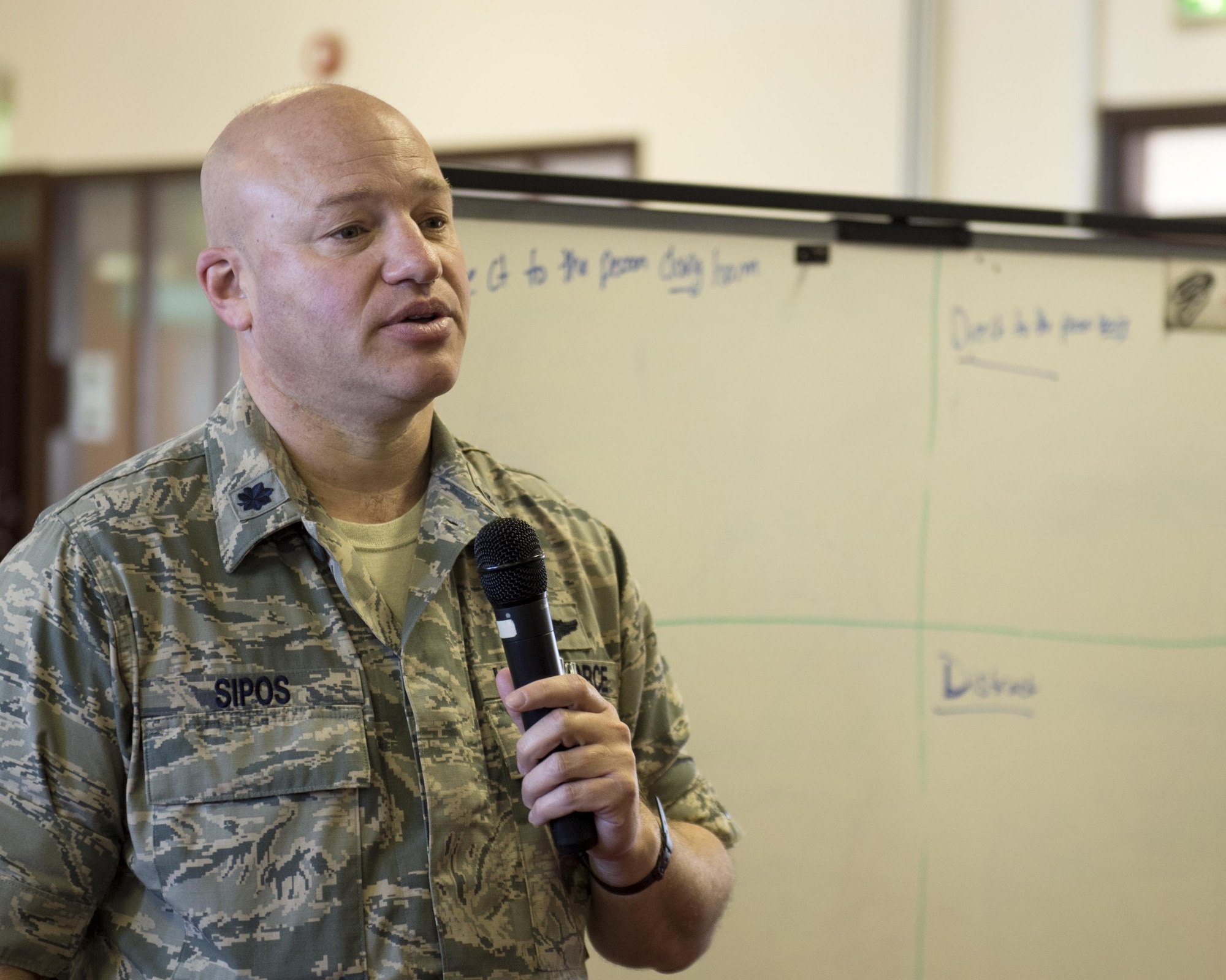 U.S. Air Force Lt. Col. Peter Sipos, 48th Aerospace Medicine Squadron flight commander, attempts to solve one of the scenarios during a Green Dot general overview training at Royal Air Force Lakenheath, England, Sept. 9. Participants in the training solve several realistic scenarios using methods taught to them during classroom discussion. (U.S. Air Force photo/Senior Airman Malcolm Mayfield)