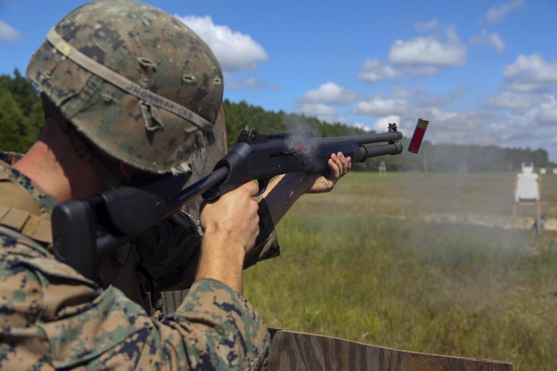Cpl. Joshua Hodel, Stone Bay target shed noncommissioned officer in charge, fires a Benelli M4 shotgun at a target during a Combat Marksmanship Trainer Course were tested on coordinating a 3-gun shooting competition at Stone Bay on Marine Corps Base Camp Lejeune, Sept. 1. The competition enabled CMT students to become familiar with how to set up and run a range and range personnel were also able to hone their marksmanship skills. (U.S. Marine Corps photo by Cpl. Mark Watola /Released)