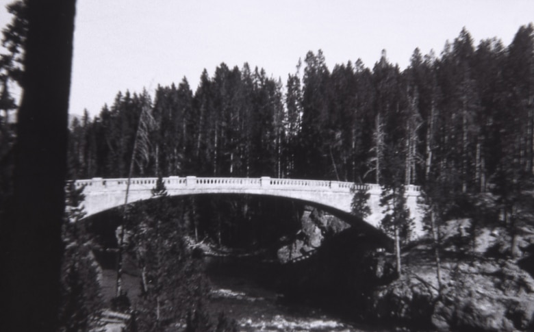 The steel and concrete bridge Melan arch bridge over the Yellowstone River, above the Upper Falls. Chittenden led the project selecting its design because he felt its location merited an artistic design because of its prominent location in the Park. The bridge was known as the Chittenden Bridge until it was replaced with a more modern structure in 1963 named the Chittenden Memorial Bridge. 