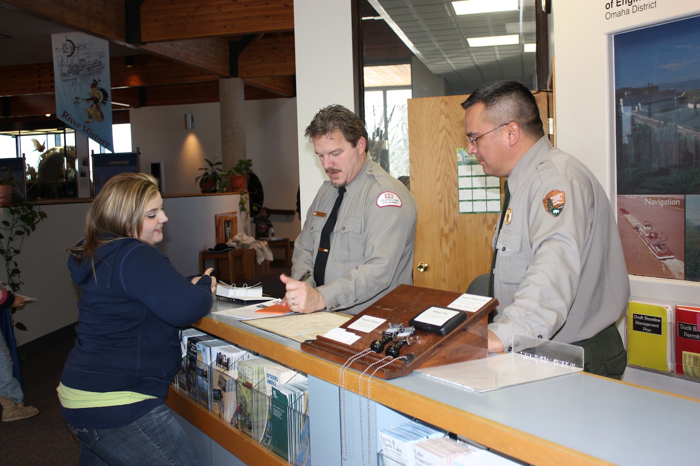 USACE Natural Resource Specialist Galen Jons and National Park Service Park Ranger Dugan Smith talk with a visitor during Bald Eagle Days. For this annual two day event the USACE and NPS bring in raptor rehabilitators with live bird to conduct programs about raptors. The partnership between the USACE and NPS allows this to be a free program that hundreds of people attend annually.