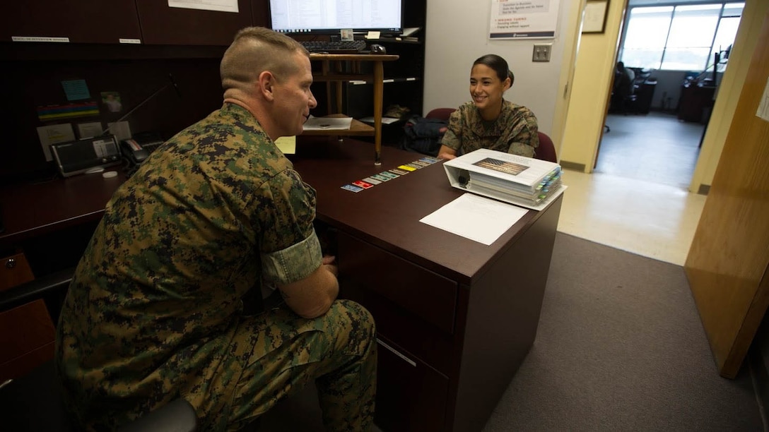 Staff Sgt Craig W. Harriman, left, speaks to Cpl. Andrea N. Villacis about her career progression aboard Marine Corps Air Station Cherry Point, N.C., Sept. 12, 2016. Harriman was awarded Career Planner of the Year for fiscal year 2016 and has been recently selected to instruct at the Basic Career Planners Course at Marine Corps Recruit Depot, San Diego, Calif. He attributes his success to the leadership and mentoring he received during his years in the Corps. Harriman is the staff noncommissioned officer in charge of career planners assigned to Marine Air Control Group 28, 2nd Marine Aircraft Wing. Villacis is an administrative clerk with the unit. 