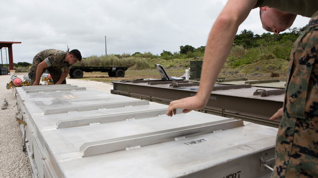 U.S. Aviation Ordnance Marines with Marine Aviation Logistics Squadron12 prepare ordnance for aviation squadrons participating in Valiant Shield 16 at Andersen Air Force Base, Guam, September 12, 2016. The ordnance constructed, provided the Marines of MALS 12 valuable experience assembling live ordnance to be used  during VS16 for a sinking exercise. VS16 is a biennial U.S. only, field training exercise that focuses on joint training with U.S. Navy, Air Force and Marine Corps to increase interoperability and working relationships. 