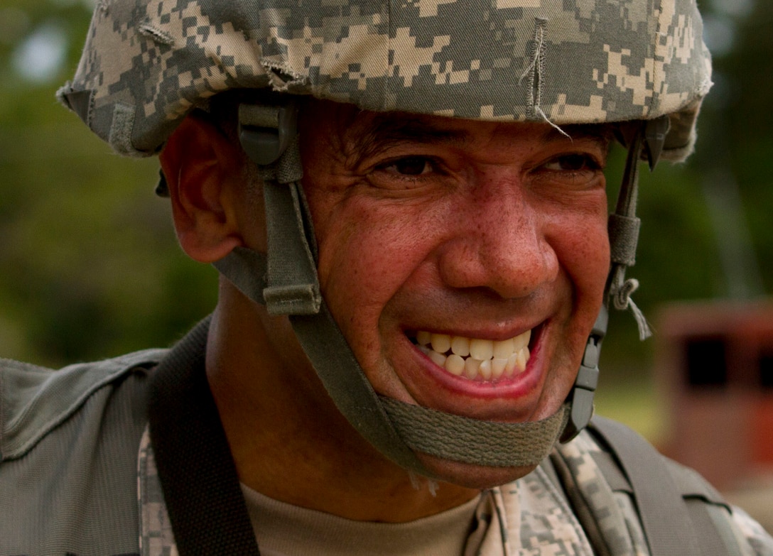Sgt. John Carvajal, a U.S. Army Reserve human resources sergeant with the 200th Military Police Command, embraces the pain during a ruck march on Fort Meade, Md., Sept. 11. The march was five miles long and each of the Soldiers were required to carry a ruck that weighed at least 35 pounds.  (U.S. Army Reserve photo by Sgt. Audrey Hayes)