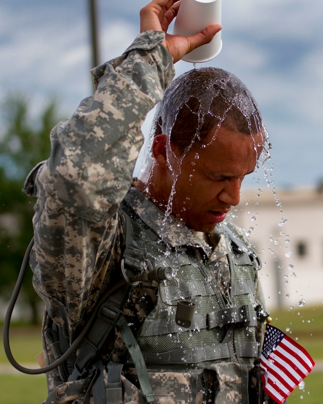 Staff Sgt. Gylian Page, a U.S. Army Reserve Chaplin’s assistant with the 200th Military Police Command, cools down after finishing a ruck march on Fort Meade, Md., Sept. 11. The march was five miles long and each of the Soldiers were required to carry a ruck that weighed at least 35 pounds.  (U.S. Army Reserve photo by Sgt. Audrey Hayes)