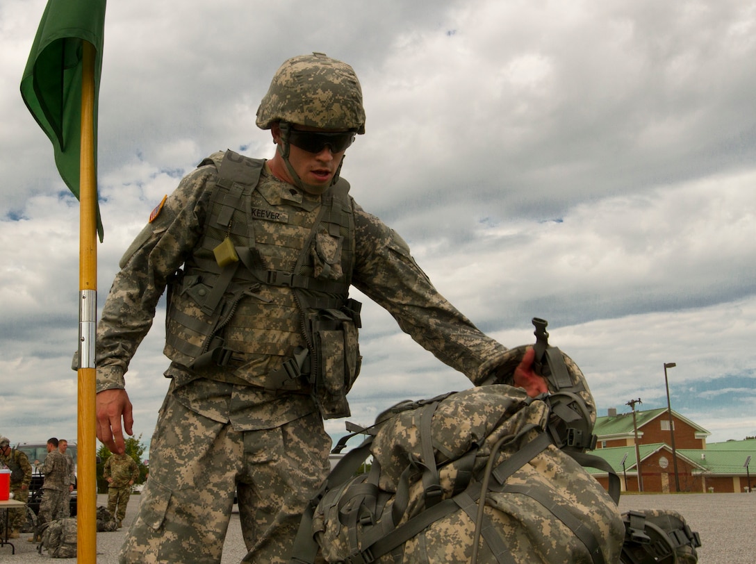 Spc. McKeever, John, a U.S. Army Reserve Soldier with the 200th Military Police Command, takes off his ruck sack after finishing a ruck march on Fort Meade, Md., Sept. 11. The march was five miles long and each of the Soldiers were required to carry a ruck that weighed at least 35 pounds.  (U.S. Army Reserve photo by Sgt. Audrey Hayes)