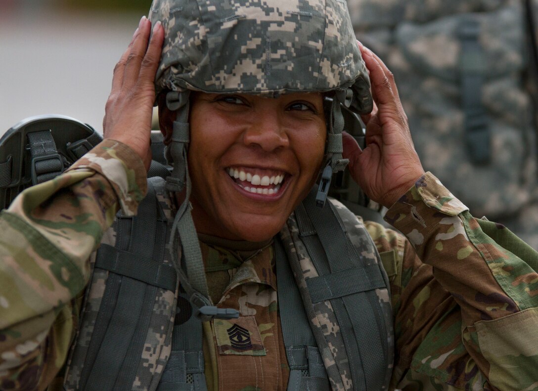 1st. Sgt. Tomeka Johnson, the senior enlisted leader for the Headquarters Company with the 200th Military Police Command, takes off her helmet after finishing a ruck march on Fort Meade, Md., Sept. 11. The march was five miles long and each of the Soldiers were required to carry a ruck that weighed at least 35 pounds.  (U.S. Army Reserve photo by Sgt. Audrey Hayes)