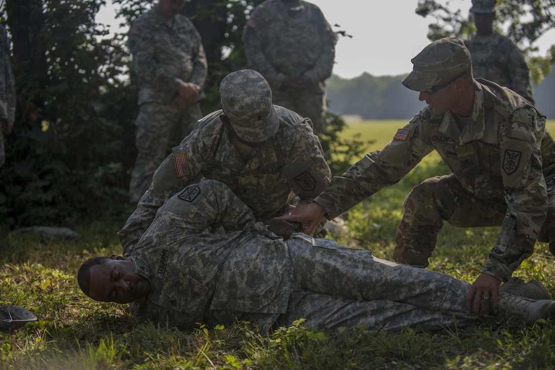 U.S. Army Reserve Sgt. Robert Crawford instructs 1st Lt. Asriel Janifer, both assigned to the 200th Military Police Command, on proper search techniques of a suspect during Army Warrior Tasks training at Laudrick Creek Military Reservation, Md., Sept. 10. The training, held during September's Battle Assembly, consisted of stations covering Chemical, Biological, Radiological, and Nuclear attack;  9-Line Medical Evacuation; search of a suspect; individual movement techniques and others. (U.S. Army Reserve photo by Staff Sgt. Shejal Pulivarti/released)