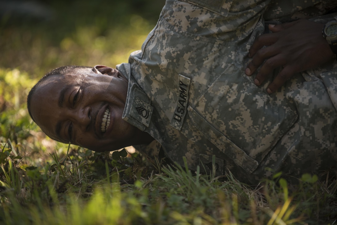 U.S. Army Reserve Staff Sgt. Wilbert Adams, a military police, assigned to the 200th Military Police Command, role plays as a suspect during Army Warrior Tasks training at Laudrick Creek Military Reservation, Md., Sept. 10. Soldiers often wear the insignia for the next rank under their collar as a reminder to  continue progressing in their career. (U.S. Army Reserve photo by Staff Sgt. Shejal Pulivarti/released)