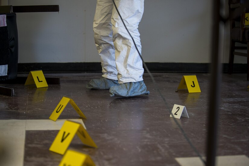 A U.S. Army criminal investigation special agent measures the length of a room during Capital Shield 2016 at Fort Belvoir, Sept. 13. Approximately 15 U.S. Army Reserve criminal investigative special agents trained alongside 25 active duty agents for the first time in a joint training exercise known as Capital Shield, focusing on crime scene processing, evidence management and hostage negotiations, held Virginia, Sept. 13-15. The reserve Soldiers participating in this year's Capital Shield are agents from the 733rd Military Police Battalion (Criminal Investigation Division), headquartered in Fort Gillem, Georgia, which reports to the 200th Military Police Command. The active duty agents belong to various offices across the Washington CID Battalion, headquartered at Fort Myer, Virginia. (U.S. Army Reserve photo by Master Sgt. Michel Sauret)