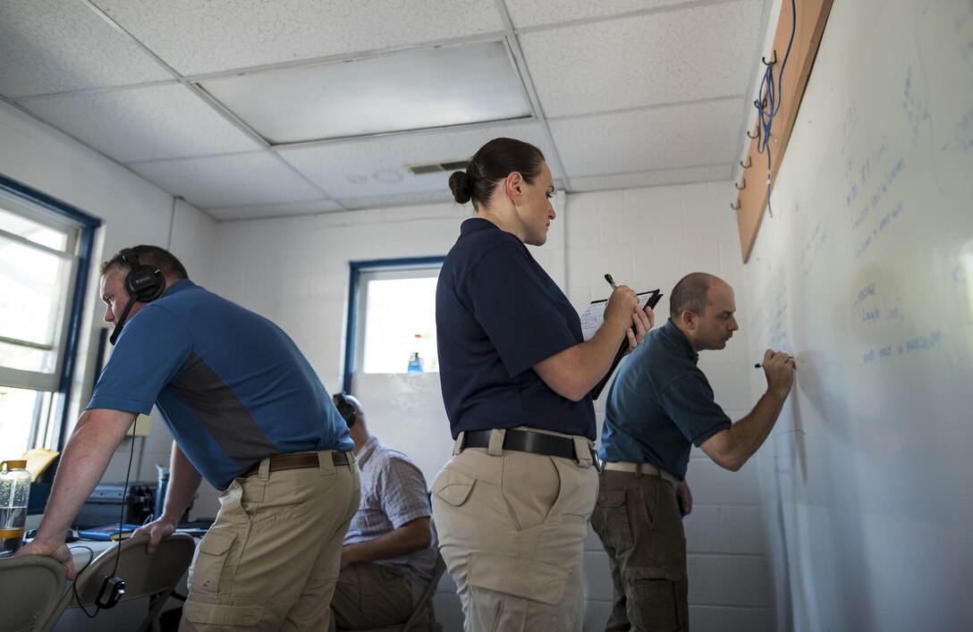 U.S. Army Reserve criminal investigative special agents train alongside active duty agents for the first time in a joint training exercise known as Capital Shield, focusing on crime scene processing, evidence management and hostage negotiations, held at Fort Belvoir, Virginia, Sept. 13-15. The reserve Soldiers participating in this year's Capital Shield are agents from the 733rd Military Police Battalion (Criminal Investigation Division), headquartered in Fort Gillem, Georgia, which reports to the 200th Military Police Command. The active duty agents belong to various offices across the Washington CID Battalion, headquartered at Fort Myer, Virginia. (U.S. Army Reserve photo by Master Sgt. Michel Sauret)