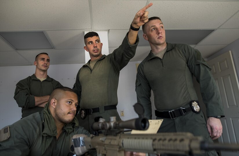 2nd Lt. Ryan Tire, team commander of the Special Reaction Team, Military District of Washington, gives directions to his members for a training event in support of Capital Shield 2016 at Fort Belvoir, Virginia, Sept. 14.  Approximately 15 U.S. Army Reserve criminal investigative special agents trained alongside 25 active duty agents for the first time in a joint training exercise known as Capital Shield, focusing on crime scene processing, evidence management and hostage negotiations, held Sept. 13-15. The reserve Soldiers participating in this year's Capital Shield are agents from the 733rd Military Police Battalion (Criminal Investigation Division), headquartered in Fort Gillem, Georgia, which reports to the 200th Military Police Command. The active duty agents belong to various offices across the Washington CID Battalion, headquartered at Fort Myer, Virginia. (U.S. Army Reserve photo by Master Sgt. Michel Sauret)