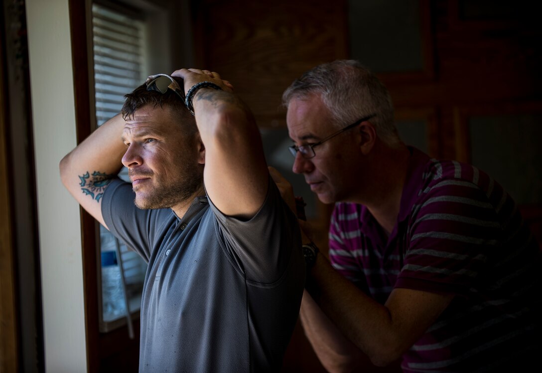 1st Sgt. Donald Rackley, senior enlisted leader of the 733rd Military Police Battalion (Criminal Investigation Division), holds hostage Gerald Hall, criminal intelligence coordinator for the Washington Criminal Investigation Division Battalion, during Capital Shield 2016 at Fort Belvoir, Virginia, Sept. 14. Approximately 15 U.S. Army Reserve criminal investigative special agents trained alongside 25 active duty agents for the first time in a joint training exercise known as Capital Shield, focusing on crime scene processing, evidence management and hostage negotiations, held Sept. 13-15. The reserve Soldiers participating in this year's Capital Shield are agents from the 733rd MP Bn. (CID), headquartered in Fort Gillem, Georgia, which reports to the 200th Military Police Command. The active duty agents belong to various offices across the Washington CID Battalion, headquartered at Fort Myer, Virginia. (U.S. Army Reserve photo by Master Sgt. Michel Sauret)