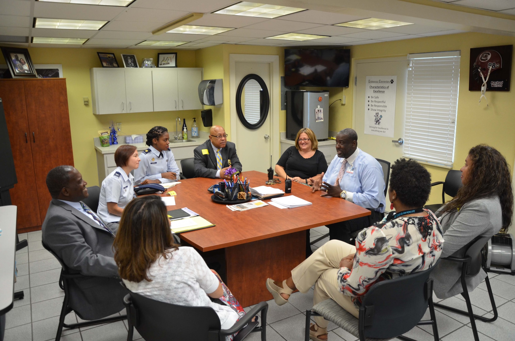 Rachad Wilson (right, in light blue), principal of Endeavour Elementary School, Cocoa, Fla., discusses the community school program with Dr. Jarris L. Taylor Jr.,  Deputy Assistant Secretary of the Air Force for Strategic Diversity Initiative, Sept. 7, 2016.  Taylor and members of his staff were in town for the Women in Science and Engineering Symposium hosted by the Air Force Technical Applications Center at Patrick AFB, Fla., which is also a community partner with the local elementary school.  Also pictured starting from bottom left to right:  Doreen Carlo-Coryell, Endeavour’s assistant principal; Michele Scott, planning director for Children’s Home Society; Rose Day, AFTAC’s human resources program manager; Wilson, Christy Meraz, Endeavour’s assistant principal; Ed Lee, program coordinator for historically black colleges and minority institutions; Maj. Denisha Darcus and Col. Angela Giddings, both with the Air Force Diversity and Inclusion office; and Taylor.  (U.S. Air Force photo by Susan A. Romano)