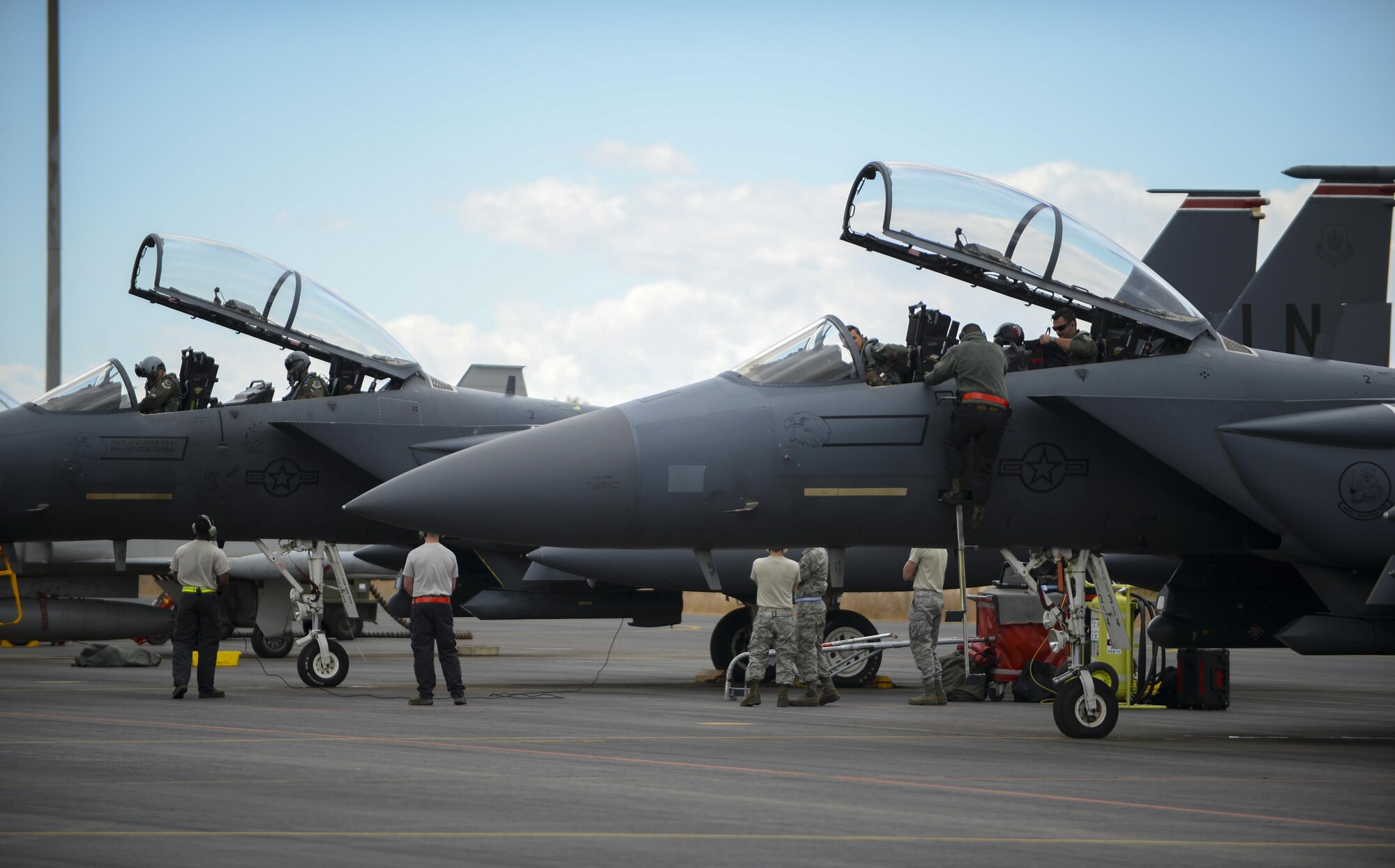 Members of the 494th Air Craft Maintenance Unit prepare F-15E Strike Eagles for a sortie in support of Tactical Leadership Programme 16-3 at Los Llanos Air Base, Spain Sep. 14, 2016. The training prepares NATO and allied forces’ flight leaders to be mission commanders, lead coalition force air strike packages, instruct allied flying and non-flying personnel in matters related to tactical composite air operations, and provide tactical air expertise to NATO agencies. (U.S. Air Force photo/ Staff Sgt. Emerson Nuñez)