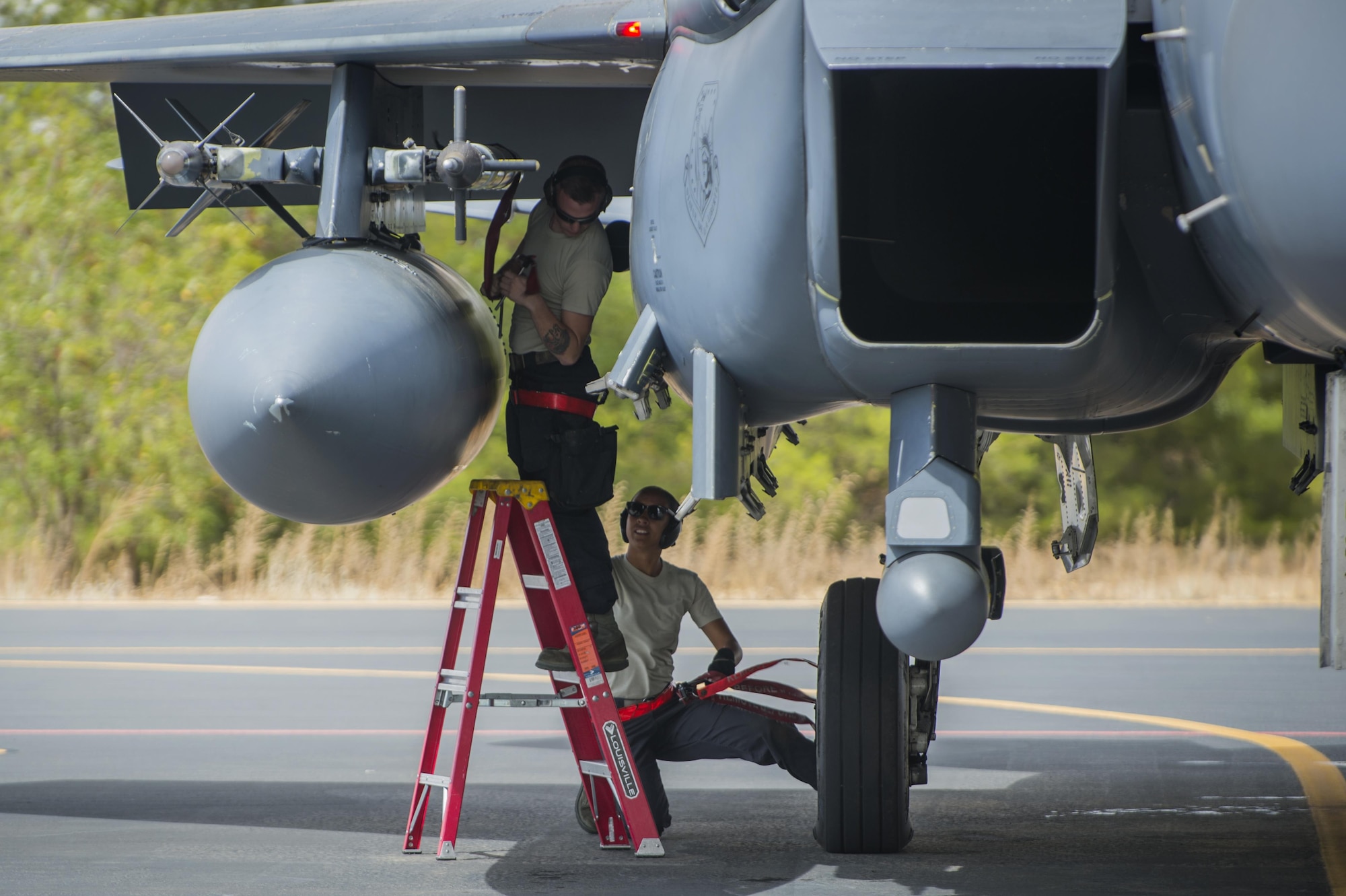 Senior Airman Jackson Dancy, left, and Airman 1st Class Alexis Rodriguez, 494th Air Craft Maintenance Unit load crew member, prepare an F-15E Strike Eagle prior to a sortie in support of Tactical Leadership Programme 16-3 at Los Llanos Air Base, Spain Sep. 14, 2016. Throughout its 39 year history, TLP has become the focal point for NATO’s Allied Air Forces tactical training, developing knowledge and leadership skills, necessary to face today's air tactical challenges. (U.S. Air Force photo/ Staff Sgt. Emerson Nuñez)