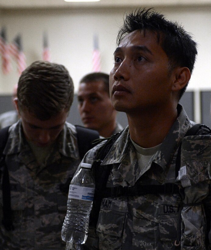 Tech. Sgt. Phong Pham, 2nd Operations Support Squadron, listens to a briefing before deploying from Barksdale Air Force Base, La., Sept. 10, 2016. More than 350 Airmen from Barksdale deployed to Al Udeid Air Base, Qatar, from Sept. 6-10 in support of Operation Inherent Resolve. The mission of OIR is to defeat the terrorist organization DA’ESH, commonly referred to as ISIS, to increase regional stability. (U.S. Air Force photo/Senior Airman Curt Beach)