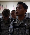 Tech. Sgt. Phong Pham, 2nd Operations Support Squadron, listens to a briefing before deploying from Barksdale Air Force Base, La., Sept. 10, 2016. More than 350 Airmen from Barksdale deployed to Al Udeid Air Base, Qatar, from Sept. 6-10 in support of Operation Inherent Resolve. The mission of OIR is to defeat the terrorist organization DA’ESH, commonly referred to as ISIS, to increase regional stability. (U.S. Air Force photo/Senior Airman Curt Beach)