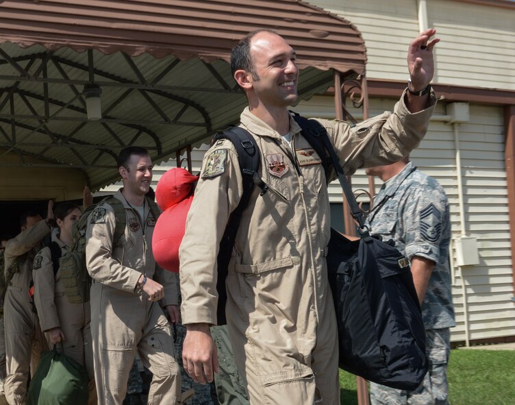 Capt. John Blankenship, 11th Bomb Squadron pilot, waves goodbye as he prepares to board a plane to deploy from Barksdale Air Force Base, La., Sept. 10, 2016. More than 350 Airmen from Barksdale deployed to Al Udeid Air Base, Qatar, from Sept. 6-10 in support of Operation Inherent Resolve. The team is a composite force with representation from the 11th BS, 20th Bomb Squadron, 96th Bomb Squadron and the 2nd Operations Support Squadron. While deployed, they will be combined under the 96th Expeditionary Bomb Squadron. (U.S. Air Force photo/Senior Airman Curt Beach)