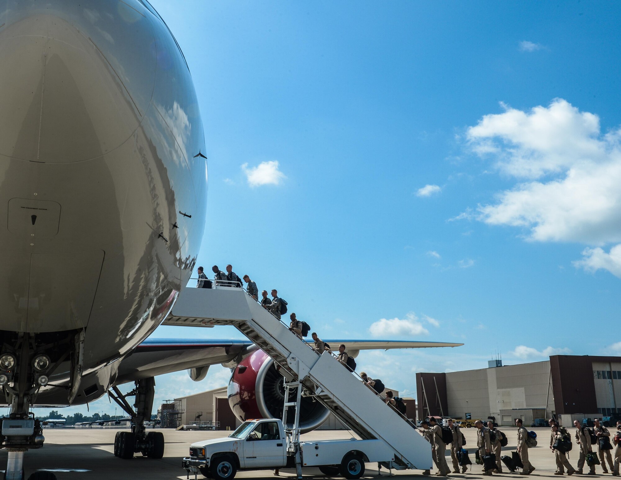 Barksdale Airmen board a plane to deploy to Al Udeid Air Base, Qatar, from Barksdale Air Force Base, La., Sept. 10, 2016. The team is a composite force with representation from the 11th Bomb Squadron, 20th Bomb Squadron, 96th Bomb Squadron and the 2nd Operations Support Squadron. While deployed, they will be combined under the 96th Expeditionary Bomb Squadron. (U.S. Air Force photo/Senior Airman Curt Beach)