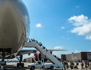 Barksdale Airmen board a plane to deploy to Al Udeid Air Base, Qatar, from Barksdale Air Force Base, La., Sept. 10, 2016. The team is a composite force with representation from the 11th Bomb Squadron, 20th Bomb Squadron, 96th Bomb Squadron and the 2nd Operations Support Squadron. While deployed, they will be combined under the 96th Expeditionary Bomb Squadron. (U.S. Air Force photo/Senior Airman Curt Beach)
