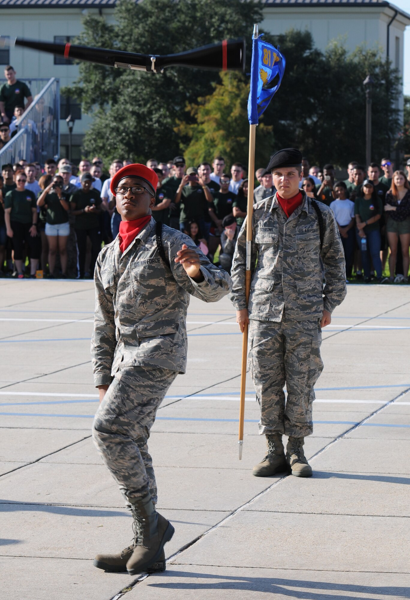Airmen 1st Class Derrick Notice, and Nicholas Scoggins, 336th Training Squadron freestyle drill team members, perform during the 81st Training Group drill down at the Levitow Training Support Facility drill pad Sept. 9, 2016, on Keesler Air Force Base, Miss. The 336th TRS “Red Wolves” placed first in freestyle and third in regulation and overall. (U.S. Air Force photo by Kemberly Groue/Released)