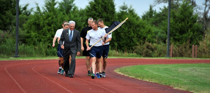 U.S. Air Force Lt. Col. (Ret.) Barry Bridger, 43rd Tactical Fighter Squadron F-4 Phantom pilot, speaks next to Col. Donald Borchelt, 1st Fighter Wing vice commander, during the first lap of a 24-hour run in honor of Prisoner of War/Missing in Action Recognition Day, at Joint Base Langley-Eustis Sept. 15, 2016. The events were held to not only pay homage to those who gave their lives fighting for their country, but to also honor and show remembrance for those who are still missing today. (U.S. Air Force photo by Tech. Sgt. Austin May)