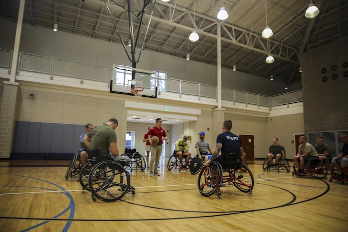 Marines with Wounded Warrior Battalion – East and Danish army wounded warriors, learn how to play wheelchair basketball at Wallace Creek Fitness Center on Marine Corps Base Camp Lejeune, Sept. 13. The two units together for a luncheon and two days full of competition and bonding on Marine Corps Base Camp Lejeune on Sept. 12-13. (U.S. Marine Corps photo by Lance Cpl. Sean J. Berry