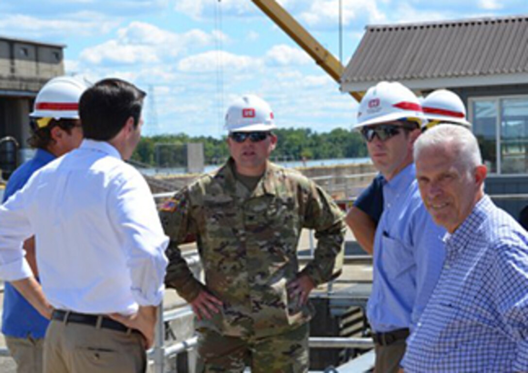 The Greenup Locks and Dam, located on the Ohio River at Greenup, Kentucky, is one of the busiest locks in the Huntington District of the U.S. Army Corps of Engineers.

But maintenance work closed the main lock chamber since April 15, 2016, while crews removed -- and replaced - the massive miter gates at the downriver end of the lock.

That can affect industry, causing barge traffic to slow down on the Ohio River -- and it brought a visit from Congressional representatives from three states -- Bill Johnson from Ohio's 6th District and Evan Jenkins from West Virginia's Third District as well as staff members from Senator Mitch McConnell's and Congressman Hal Rogers' of Kentucky offices.
