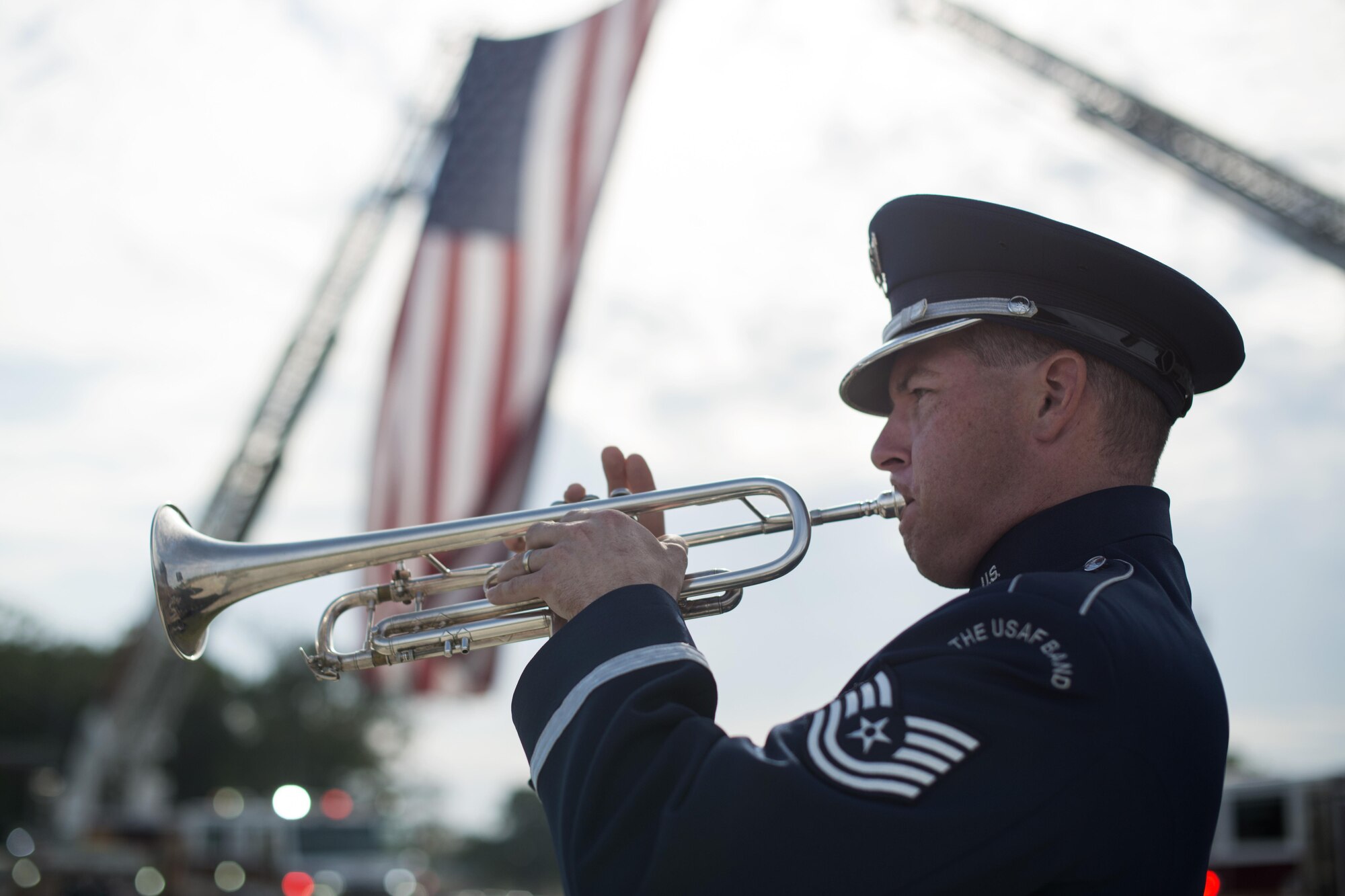 Tech. Sgt. Matthew Misener, U.S. Air Force Band trumpet player, performs at the 9/11 Remembrance Ceremony held at Heritage Park on Joint Base Andrews, Md., Sept. 9, 2016. The ceremony marked the 15th anniversary of the terrorist attacks on Sept. 11, 2001. (U.S. Air Force photo by Senior Airman Philip Bryant) 