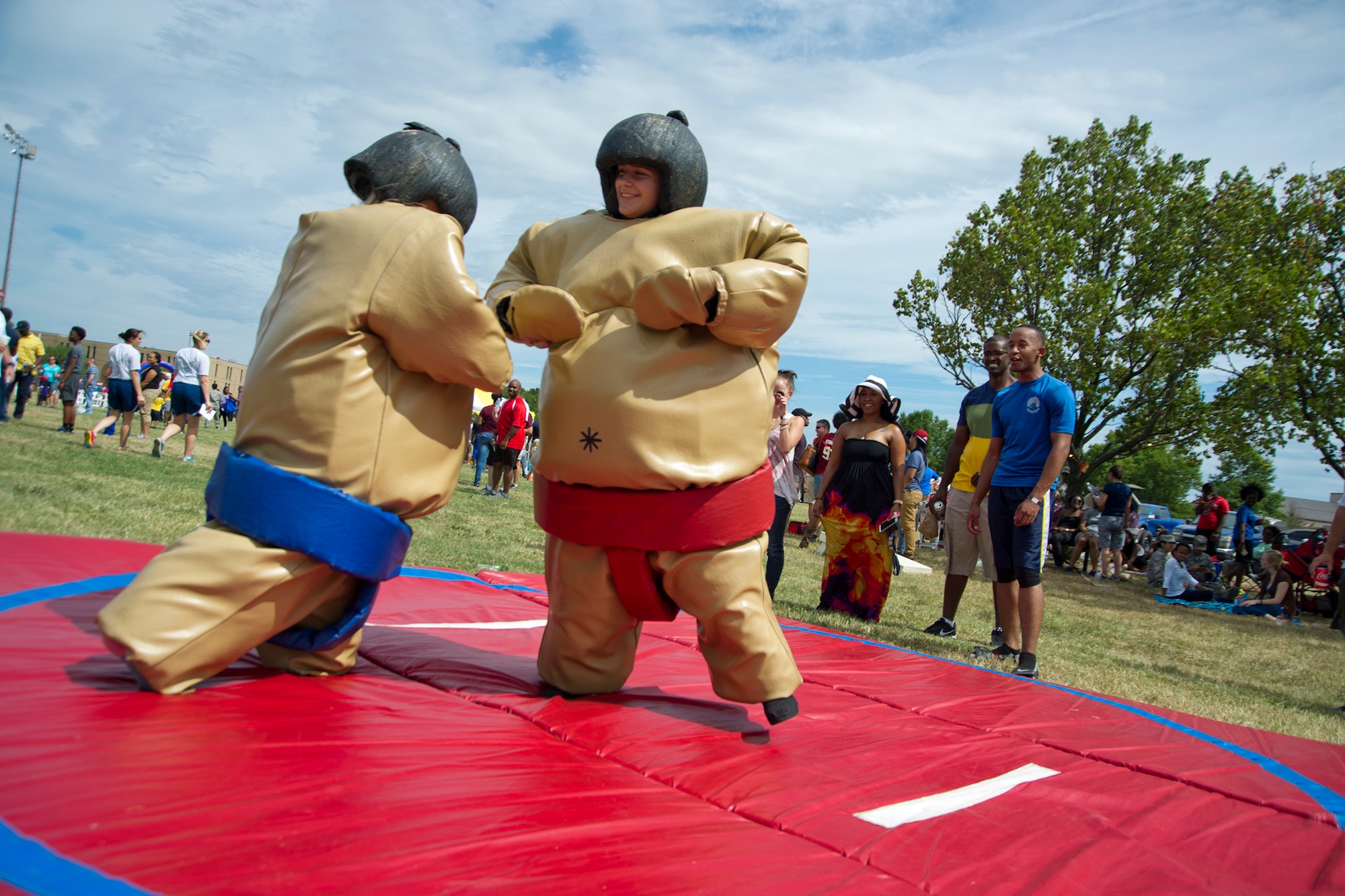459th Air Refueling Wing dependents go head-to-head in a sumo wrestling challenge during Family Day at Joint Base Andrews, Maryland, Sunday, Sept. 11, 2016. The annual event featured food, sumo wrestling, volleyball, dunk tank, children’s obstacle course, softball jump castle, photo booth and much more. (U.S. Air Force photo/Staff Sgt. Kat Justen)