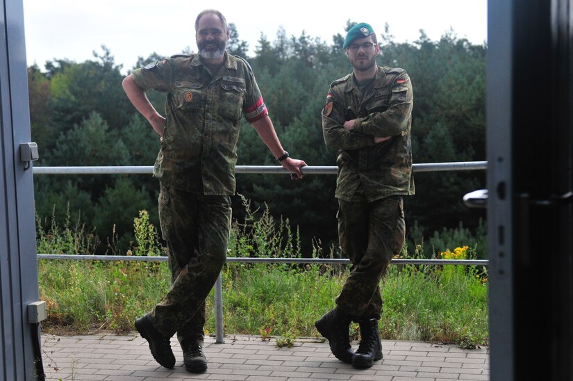 Shown on the right is 1st. Lt. Maximillion Kohl, a platoon leader in the 4th Company, 33rd Mechanized Infantry Batallion, standing in the range tower on the Puma Live-Fire Range in Bergen, Germany Sept. 31. (U.S. Army Reserve photo by Capt. Xeriqua Garfinkel, Released)