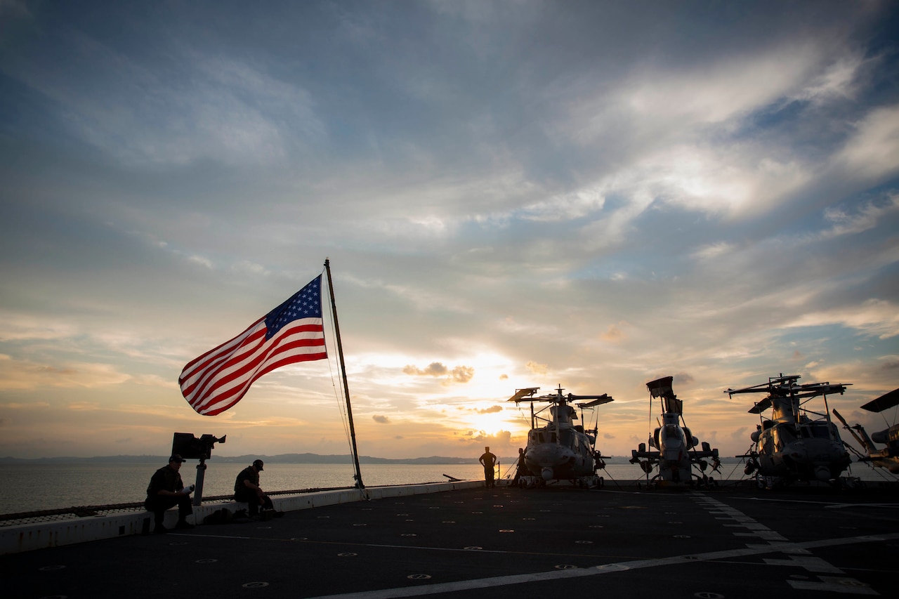 The sun sets over the USS Green Bay at White Beach Naval Base, Okinawa, Japan, Aug. 21, 2016. Marines of the 31st MEU are embarked on ships of the USS Bonhomme Richard Expeditionary Strike Group for a scheduled fall patrol of the Asia-Pacific Region. The 31st MEU is the Marine Corps’ only continuously forward-deployed Marine Air-Ground Task Force, and is task-organized to address a range of military operations in the Asia-Pacific region, from force projection and maritime security to humanitarian assistance and disaster relief. Marine Corps photo by Cpl. Darien J. Bjorndal