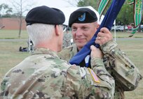Maj. Gen. Peter S. Lennon, deputy commanding general (Support), U.S. Army Reserve Command (left), officiates a change-of-command ceremony Sept. 10 between the 99th Regional Support Command’s outgoing commander, Maj. Gen. Margaret W. Boor (not pictured), and incoming commander, Brig. Gen. (P) Troy D. Kok (right), outside command headquarters on Joint Base McGuire-Dix-Lakehurst, New Jersey.