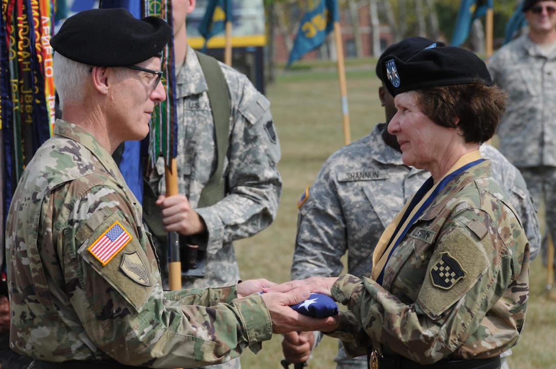 Maj. Gen. Peter S. Lennon, deputy commanding general (Support), U.S. Army Reserve Command (left), officiates a change-of-command ceremony Sept. 10 between the 99th Regional Support Command’s outgoing commander, Maj. Gen. Margaret W. Boor (center), and incoming commander, Brig. Gen. (P) Troy D. Kok (not pictured), outside command headquarters on Joint Base McGuire-Dix-Lakehurst, New Jersey.