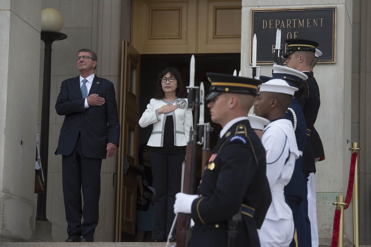 Defense Secretary Ash Carter and Japanese Defense Minister Tomomi Inada stand for the national anthem at the Pentagon, Sept. 15, 2016. Carter hosted an enhanced honor cordon to welcome Inada to the Pentagon. DoD photo by Navy Petty Officer 1st Class Tim D. Godbee
