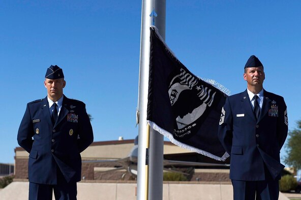 The 56th Fighter Wing command team, Brig. Gen. Brook Leonard and Chief Master Sgt. Randy Kwiatkowski, stand watch during a 24-hour POW/MIA vigil at Luke Air Force Base, Ariz., Sept. 15, 2016. National POW/MIA Recognition Day is an annual event honoring our missing service members and their families. (U.S. Air Force photo by Staff Sgt. Staci Miller)