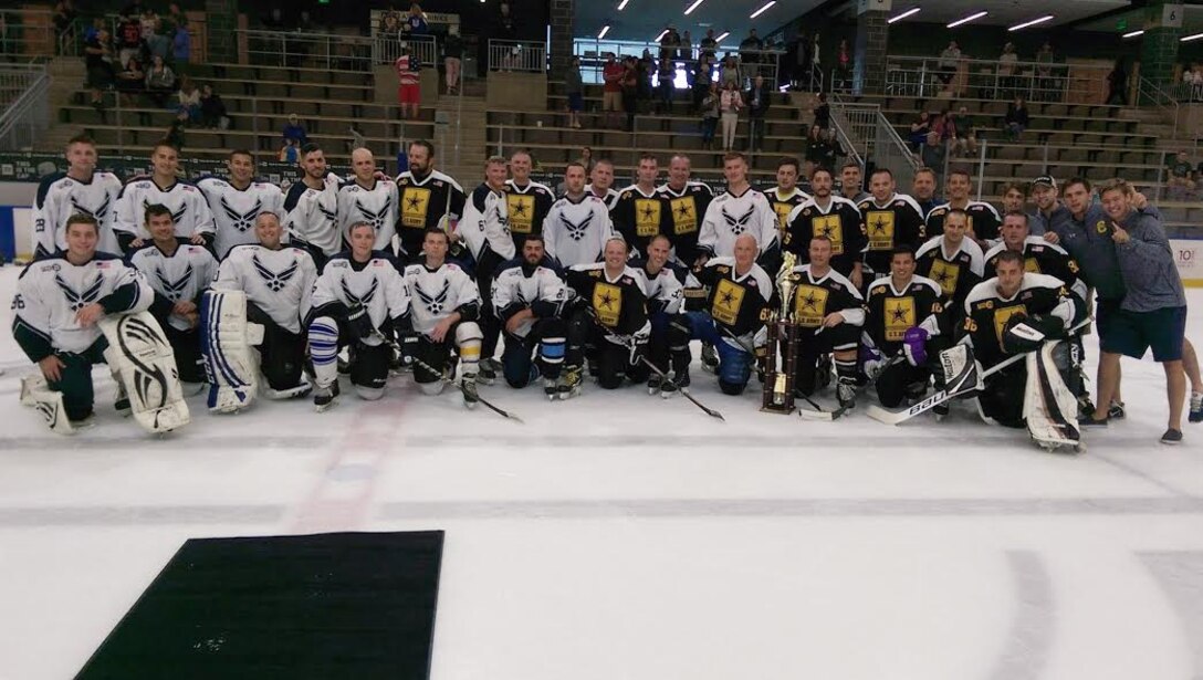 Military members pose for a photo after playing in the third annual William C. Sager, Jr. Air Force vs. Army Memorial Hockey Game, Saturday, September, 10, 2016 in Buffalo, NY. The game was held in remembrance of Tech. Sgt. Bill Sager, a former Remote Pilot Aircraft Sensor Operator with the 107th Attack Wing. (Courtesy photo by Tech Sgt. Anthony Re)