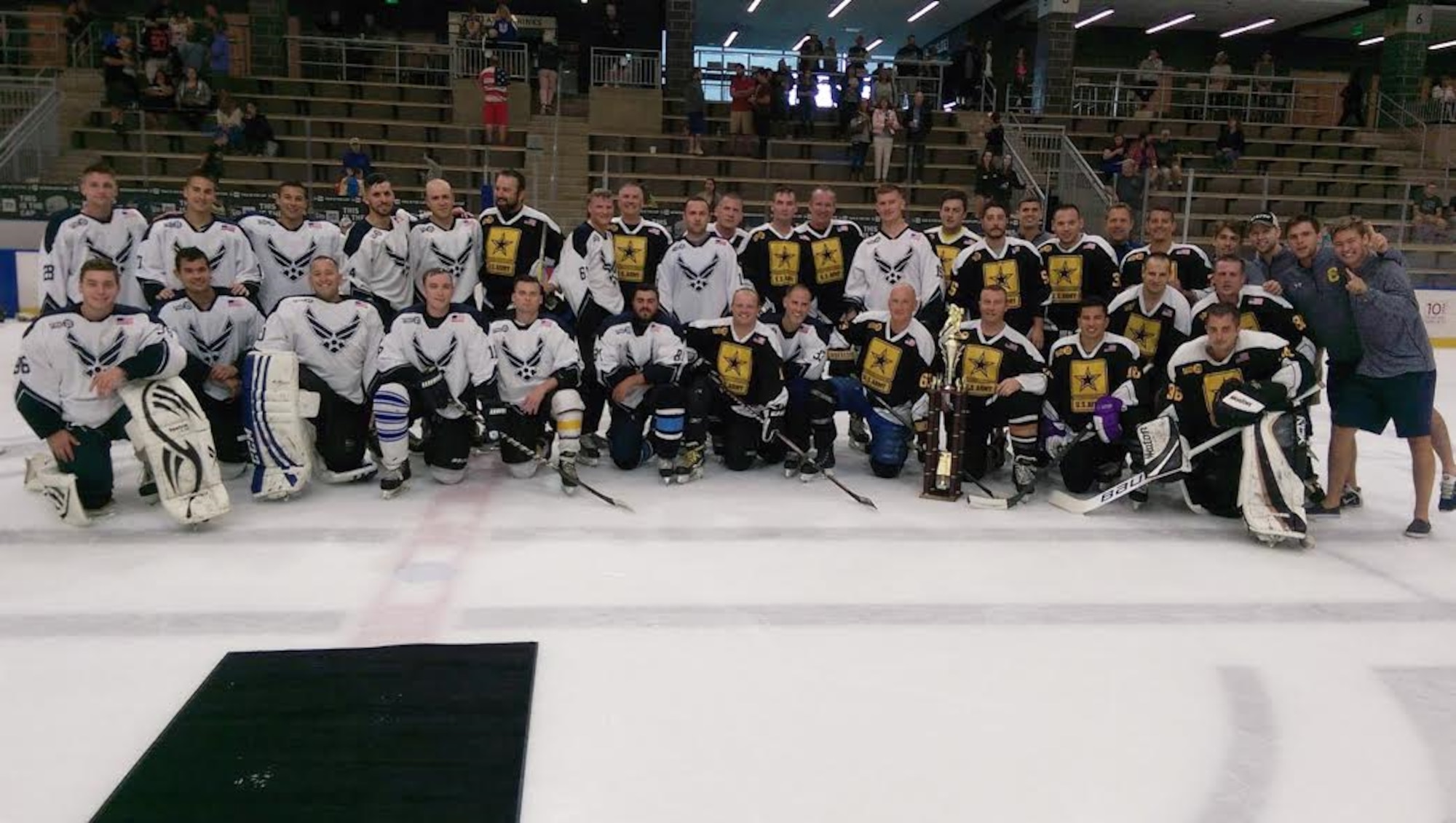 Military members pose for a photo after playing in the third annual William C. Sager, Jr. Air Force vs. Army Memorial Hockey Game, Saturday, September, 10, 2016 in Buffalo, NY. The game was held in remembrance of Tech. Sgt. Bill Sager, a former Remote Pilot Aircraft Sensor Operator with the 107th Attack Wing. (Courtesy photo by Tech Sgt. Anthony Re)