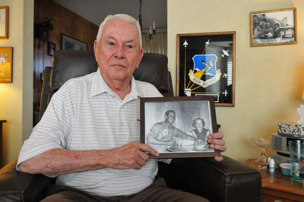 Wayne Adams, 85, holds a photo of him and his mother, Beatrice Adams, at his home in south Reno. The photo was taken at SANGA after Adams won the cross country race from Clearwater, Fla., to Reno during the inaugural National Championship Air Races in Reno in 1964. Photo by Tech. Sgt. Emerson Marcus