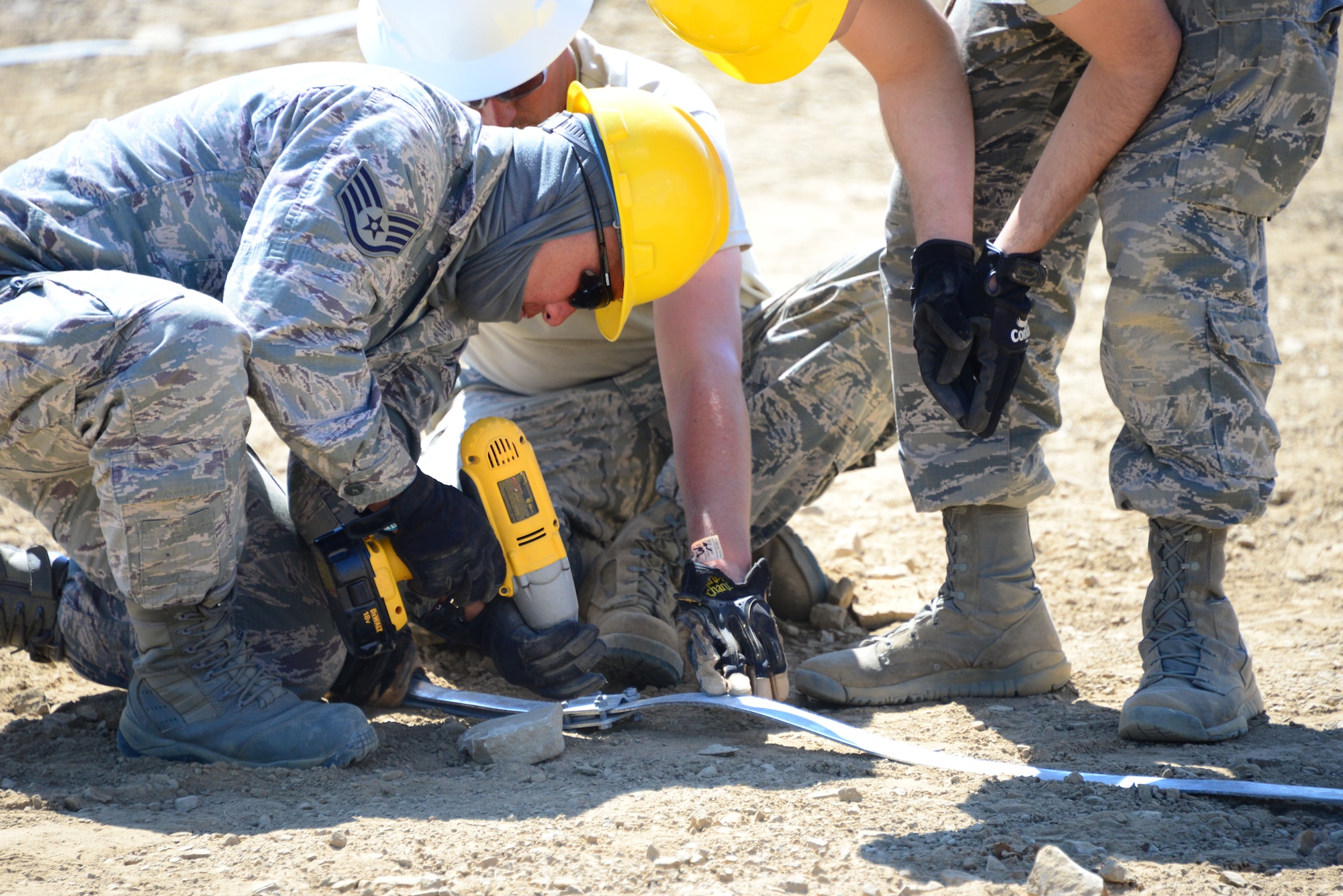 Airmen from the 118th Mission Support Group, Tennessee Air National Guard, construct lightening protection grid work for the Ammo Holding Area, better known as the AHA, Aug. 16, 2016, at Novo Selo Training Area, Bulgaria.  Tennessee National Guard Soldiers and Airmen were on rotations to complete thier portions of projects as part of Operation Resolute Castle 16, an ongoing operation of military construction to build up Eastern European base infrastructure and help strengthen ties between Tennessee's state partnership with Bulgaria. (U.S. Air National Guard photo by Master Sgt. Kendra M. Owenby, 134 ARW Public Affairs)